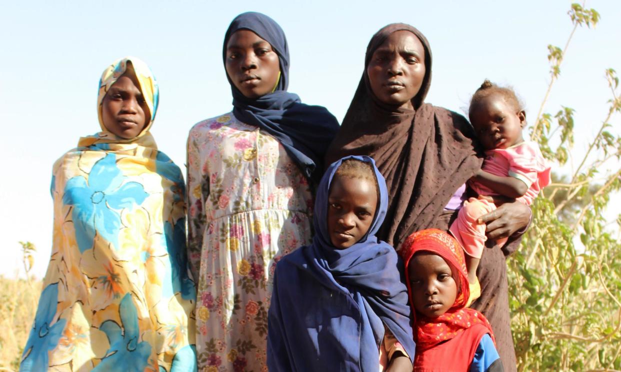 <span>Nadifa Ismail arrives in Chad with her five surviving children. The family are Masalit, and have been targeted in Darfur by the Rapid Support Forces.</span><span>Photograph: Mark Townsend/The Guardian</span>