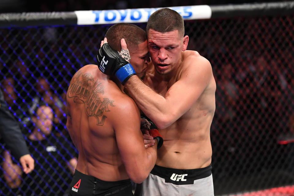 ANAHEIM, CALIFORNIA - AUGUST 17:  (R-L) Nate Diaz and Anthony Pettis embrace after their welterweight bout during the UFC 241 event at the Honda Center on August 17, 2019 in Anaheim, California. (Photo by Josh Hedges/Zuffa LLC/Zuffa LLC via Getty Images)