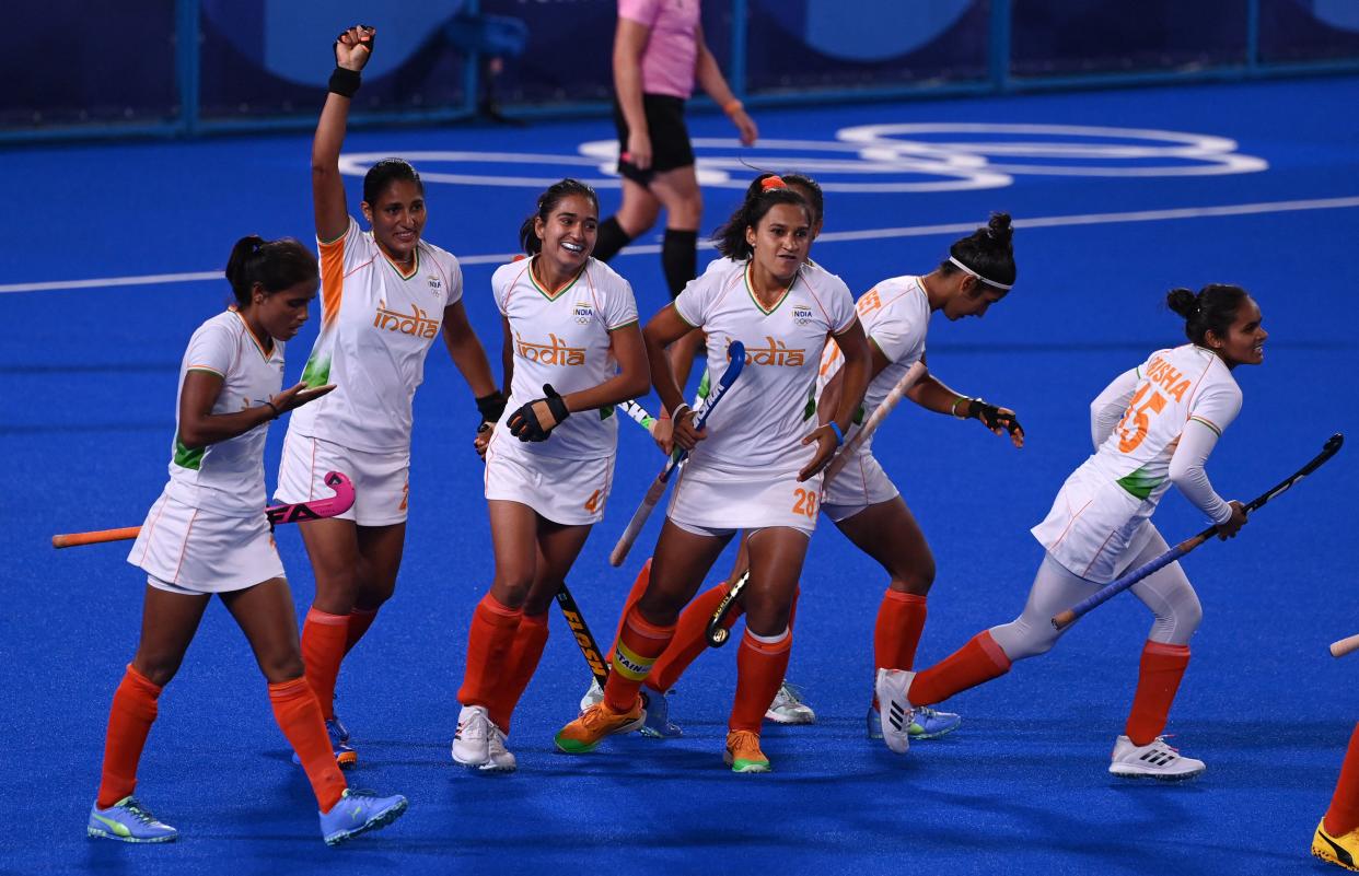 India's Gurjit Kaur (2-L) celebrates with teammates after scoring against Argentina during their women's semi-final match of the Tokyo 2020 Olympic Games field hockey competition, at the Oi Hockey Stadium in Tokyo, on August 4, 2021. (Photo by Tauseef MUSTAFA / AFP) (Photo by TAUSEEF MUSTAFA/AFP via Getty Images)