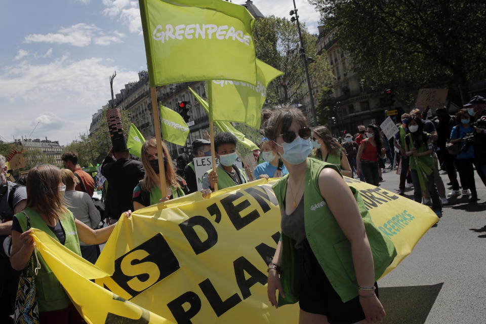 Demonstrators march during a rally against the climate change in Paris, Sunday, May 9, 2021. thousands of French demonstrators took to the streets of Paris and other cities on Sunday to call for more ambitious measures to fight against climate change. (AP Photo/Christophe Ena)
