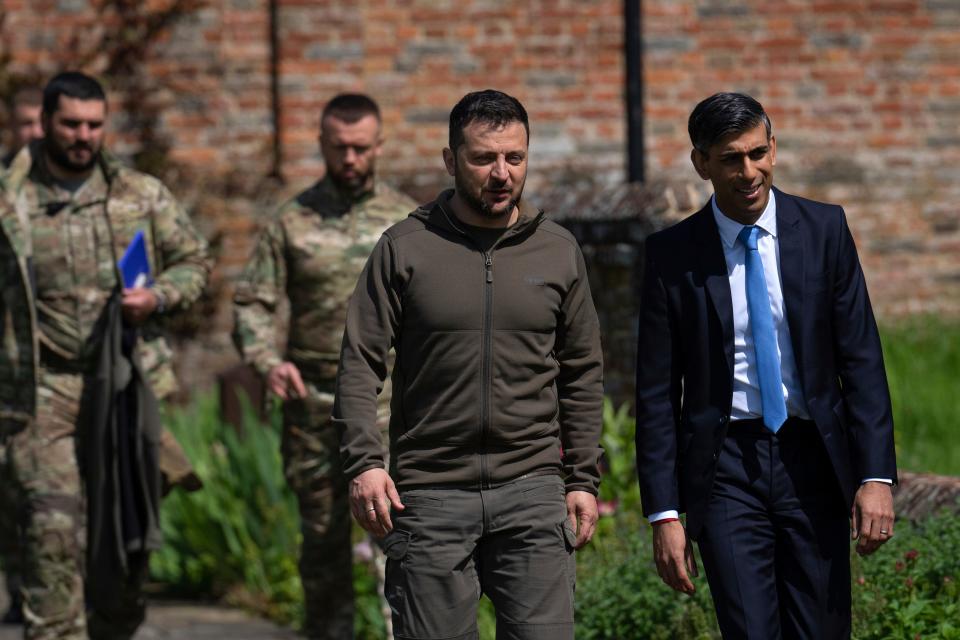 Britain's Prime Minister Rishi Sunak, right, walks Ukraine's President Volodymyr Zelenskyy to a waiting Chinook helicopter after meetings at Chequers, the prime minister's official country residence, in Aylesbury, England, Monday, May 15, 2023.