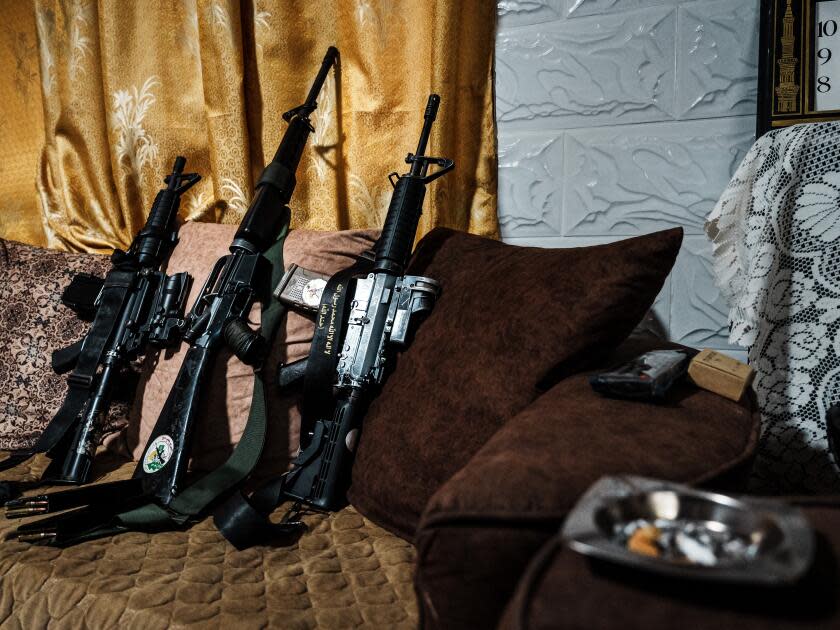 Palestinian fighters' weapons sit inside a home in Jenin, in the occupied West Bank.