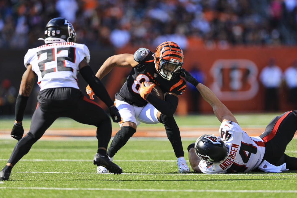 Cincinnati Bengals wide receiver Tyler Boyd (83) is tackled by Atlanta Falcons linebacker Troy Andersen (44) in the second half of an NFL football game in Cincinnati, Fla., Sunday, Oct. 23, 2022. (AP Photo/Aaron Doster)