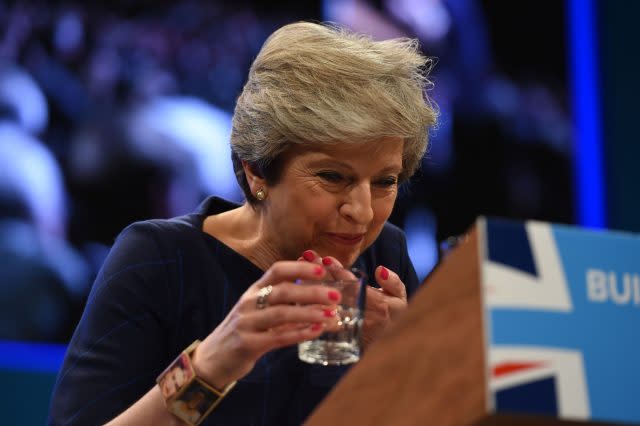 Theresa May with a glass of water during her speech
