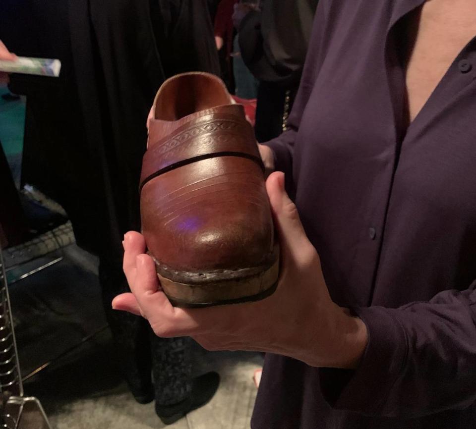 Playwright and producer Eileen Voiland shows off her 83-year-old pair of shoes at the debut showcase for her original musical, Up First Hill.