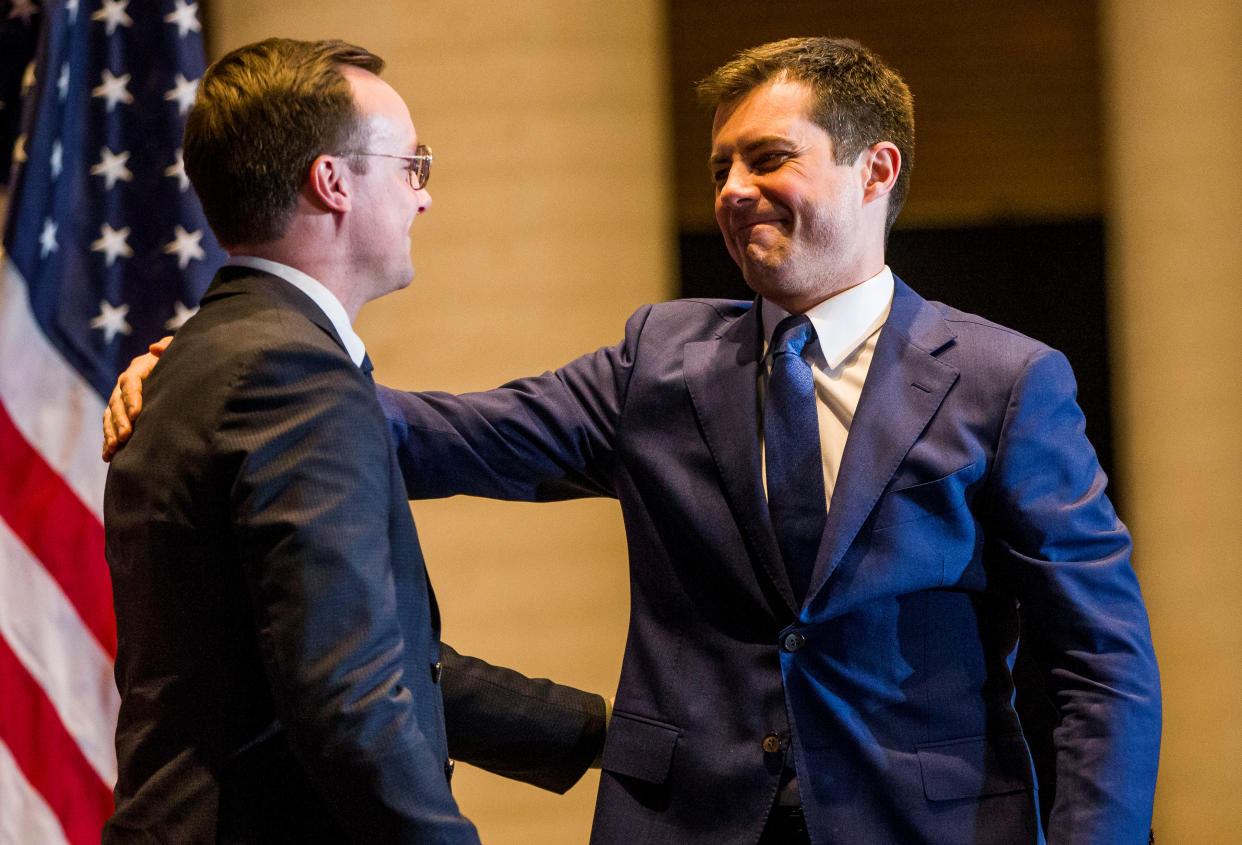Democratic U.S. presidential candidate Pete Buttigieg hugs his husband Chasten Buttigieg as he arrives at the podium to announce his withdrawal from the race for the 2020 Democratic presidential nomination during an event in South Bend, Indiana, U.S., March 1, 2020.  Mandatory Credit: Michael Caterina/South Bend Tribune via USA TODAY NETWORK via REUTERS