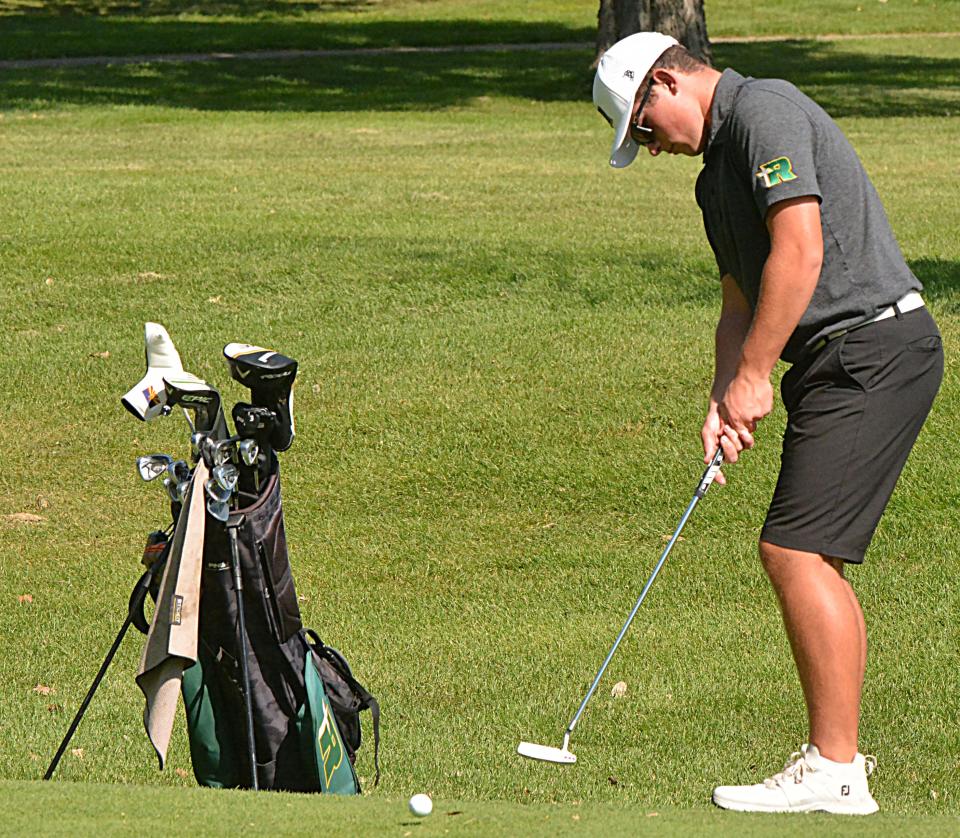 Aberdeen Roncalli's Andrew Gerlach putts from the fringe on No. 8 Yellow during the Watertown Boys Golf Invite on Tuesday, Sept. 19, 2023 at Cattail Crossing Golf Course.