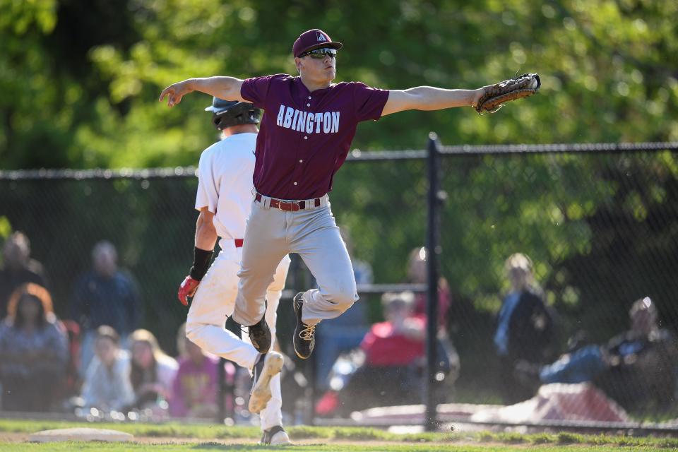 Abington first baseman Logan Moss saves an errant throw during the seventh inning of a 3-1 win at Hatboro-Horsham.