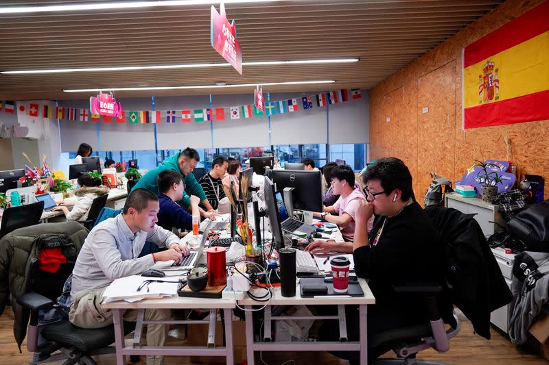 Employees work at AliExpress office at the Alibaba company's headquarters in Hangzhou