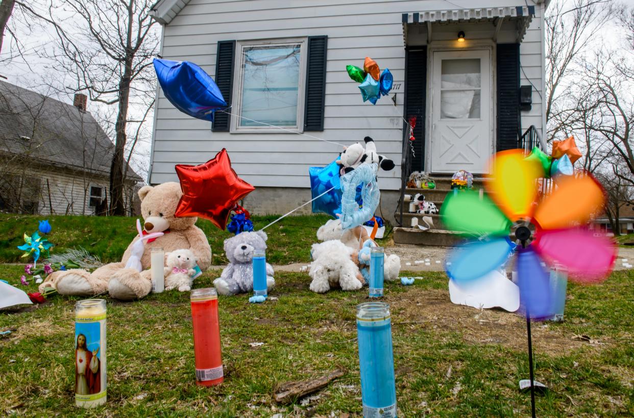 Balloon, stuffed animals, candles and other items form a memorial outside 1717 N. Gale Avenue where Navin Jones lived. The 8-year-old boy was found emaciated with signs of abuse. He died March 29 and his parents are charged in his death.
