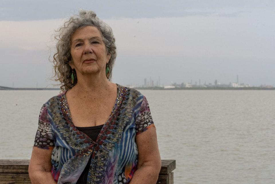 Diane Wilson stands in Port Lavaca, across Lavaca Bay from the Formosa Plastics Corp. facility, pictured on July 23, 2023. Christopher Baddour/Inside Climate News