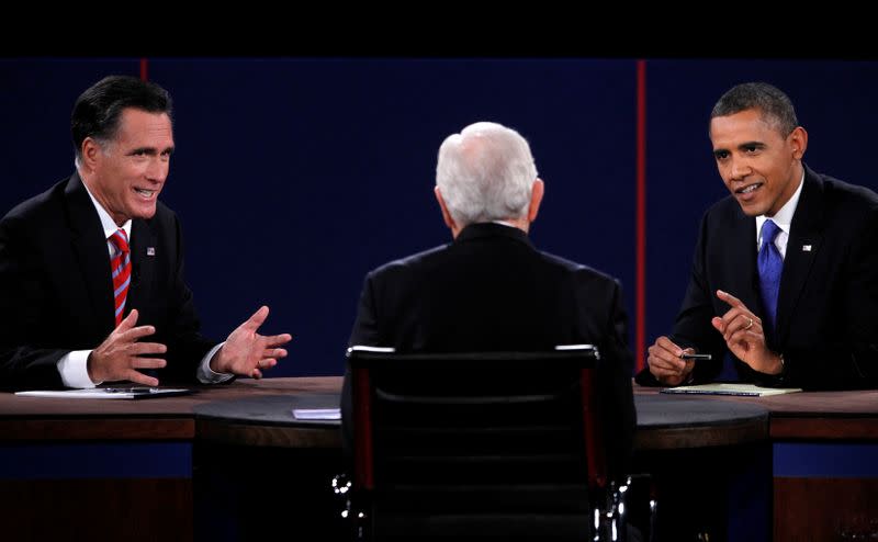 FILE PHOTO: U.S. Republican presidential nominee Romney and U.S. President Obama speak at the same time as moderator Schieffer listens during the final U.S. presidential debate in Boca Raton