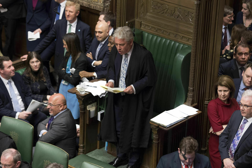 In this handout photo provided by UK Parliament, Speaker of the House John Bercow, centre, talks, during the Brexit debate in the House of Commons, London, Thursday March 14, 2019. Britain's Parliament has voted to seek a delay of the country's departure from the European Union, a move that will likely avert a chaotic withdrawal on the scheduled exit date of March 29. (UK Parliament/Jessica Taylor via AP)