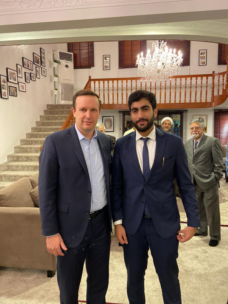 In this Saturday, Nov. 23, 2019 photo, provided by activists, U.S. Sen. Chris Murphy, D-Connecticut, left, poses with Adam Nabeel Rajab, son of imprisoned Bahraini human rights activist Nabeel Rajab, at the family's home in Manama, Bahrain. Murphy had been in the kingdom for the annual Manama Dialogue security conference. (AP Photo)