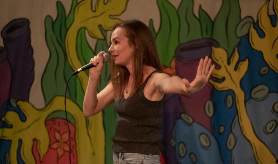 Athens-based comedian Allison Coleman onstage at Buvez in Athens in 2023. Coleman is a co-founder of Bad ATH Babes, an all-woman group that performs stand-up comedy.