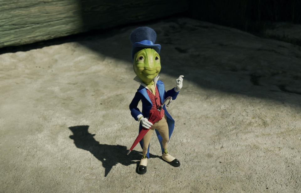 This image released by Disney shows Jiminy Cricket, voiced by Joseph Gordon-Levitt, in Disney's live-action film "Pinocchio." (Disney via AP)