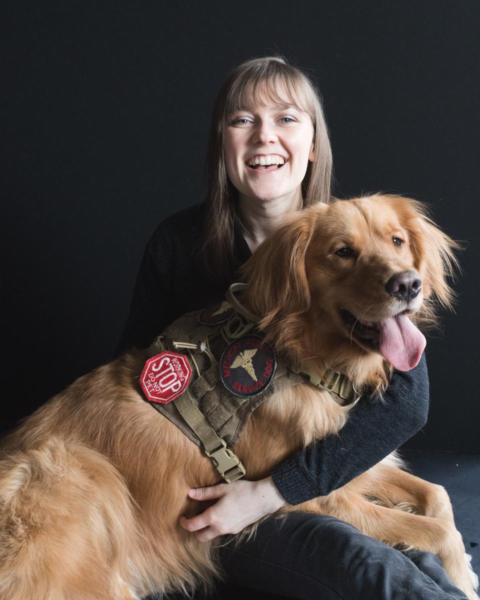 Bridgewater-Raynham graduate Meredith Aleigha Wells, seen here with Wells' service dog Scout, is performing in the Broadway musical touring production of Dr. Seuss’ "How the Grinch Stole Christmas," at the Providence Performing Arts Center through Sunday, Dec. 3, 2023.