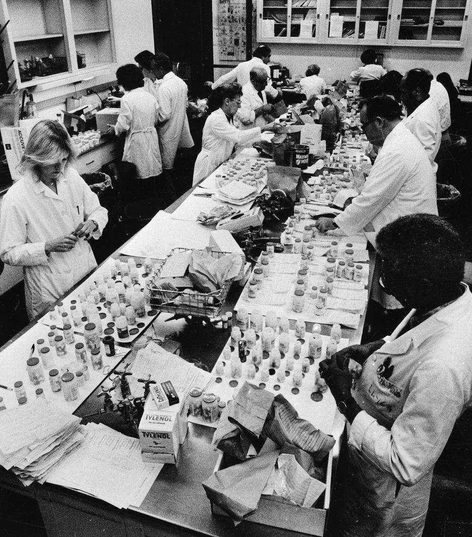Employees of the Chicago City Health Department continue to test Tylenol medication for the presence of deadly cyanide at the Department's lab on Oct. 7, 1982. (Charles Knoblock / AP)