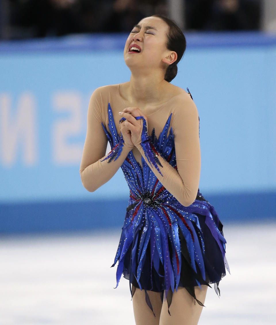 Mao Asada of Japan reacts after completing her routine in the women's free skate figure skating finals at the Iceberg Skating Palace during the 2014 Winter Olympics, Thursday, Feb. 20, 2014, in Sochi, Russia. (AP Photo/Bernat Armangue)