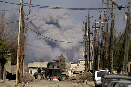 Smoke rises after an air strike, while Iraqi forces battle with Islamic State militants, in western Mosul, Iraq March 10, 2017. REUTERS/Zohra Bensemra