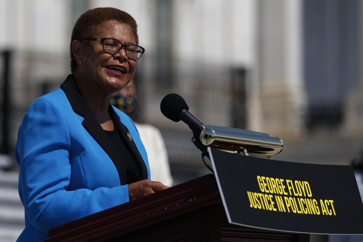 FILE - In this June 25, 2020, file photo Rep. Karen Bass, D-Calif., speaks during a news conference on the House East Front Steps on Capitol Hill in Washington. California Gov. Gavin Newsom's is considering whom to appoint to serve out the rest of Vice President-elect Kamala Harris' Senate term through 2022. Under consideration for the job include Bass, Rep. Barbara Lee of Oakland, Secretary of State Alex Padilla, and Long Beach Mayor Robert Garcia. (AP Photo/Carolyn Kaster, File)