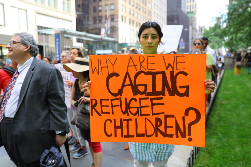 <p>A protester holds a sign protesting the U.S. policy of separating immigrant families on the terrace outside the New York Public Library on 42nd Street in New York City on June 20, 2018. (Photo: Gordon Donovan/Yahoo News) </p>