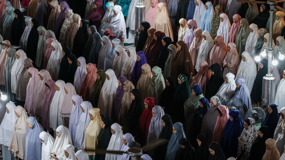 Muslim women perform Tarawih prayers at Sultan Salahuddin Abdul Aziz Mosque during the holy month of Ramadan on March 22, 2024, in Shah Alam, Selangor, Malaysia. - Annice Lyn/Getty Images