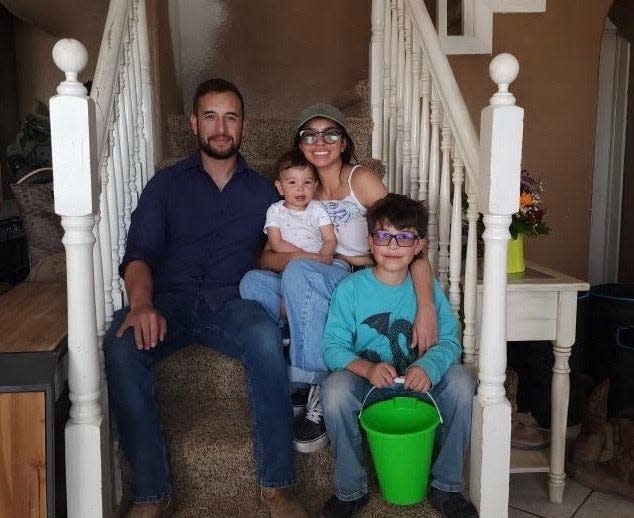 Las Cruces Police Officer Jonah Hernandez with his wife and two sons.