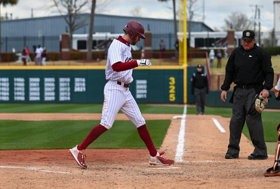 South Carolina senior outfielder Brandt Belk (17) steps on home plate during the series opener against No. 1 Texas Saturday, March 12, 2022 at Founders Park.