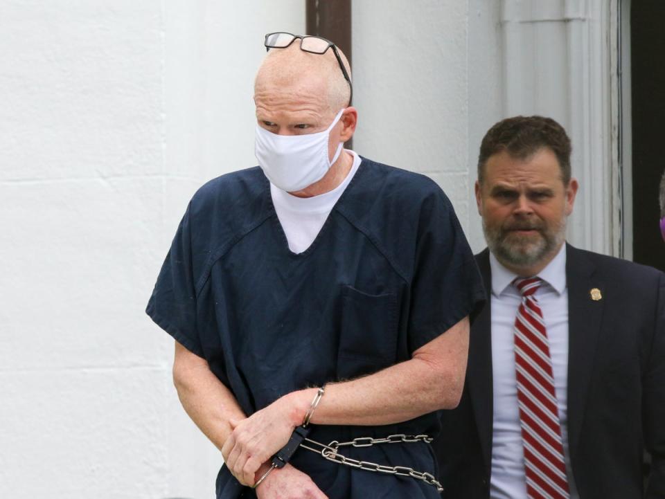 Alex Murdaugh is escorted out of the Colleton County Courthouse in Walterboro, South Carolina, on Wednesday 20 July 2022 (AP)