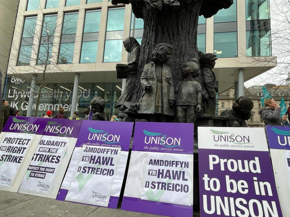 The protest took place outside the UK Government in Wales offices on Wednesday (PA)