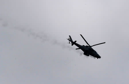 A military helicopter flies government troops continue their assault on its 105th day of clearing operations against pro-IS militants who have seized control of large parts of Marawi city, southern Philippines September 4, 2017. REUTERS/Romeo Ranoco