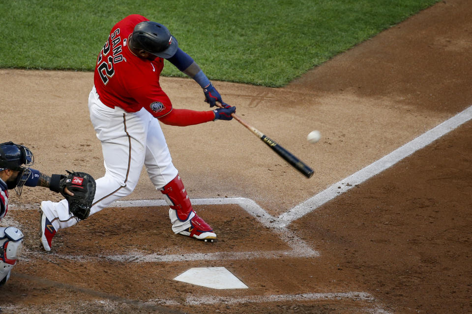 Minnesota Twins' Miguel Sano hits a solo home run against the Cleveland Indians during the fifth inning of a baseball game Saturday, Aug. 1, 2020, in Minneapolis, his second solo homer of the night. (AP Photo/Bruce Kluckhohn)