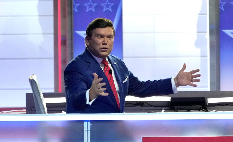 Fox News anchor Bret Baier pleads with the crowd to quiet down to keep things moving at Fiserv Forum during the first 2023 Republican presidential debate in Milwaukee on Wednesday, Aug. 23, 2023.