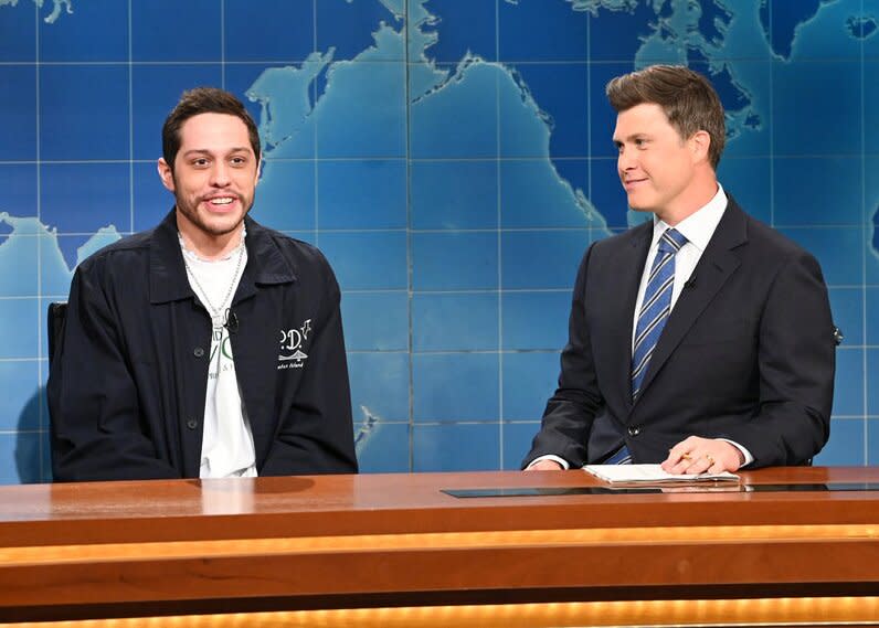 SATURDAY NIGHT LIVE -- “Natasha Lyonne, Japanese Breakfast” Episode 1826 -- Pictured: (l-r) Pete Davidson and anchor Colin Jost during Weekend Update on Saturday, May 14, 2022 -- (Photo by: Will Heath/NBC)