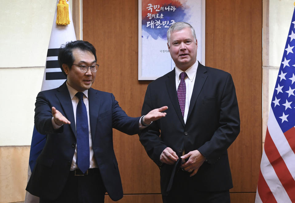 U.S. special envoy for North Korea Stephen Biegun, right, is ushered by South Korea's special representative for Korean Peninsula Peace and Security Affairs Lee Do-hoon, left, for their meeting at the Foreign Ministry in Seoul Tuesday, Sept. 11, 2018. (Jung Yeon-je/Pool Photo via AP)