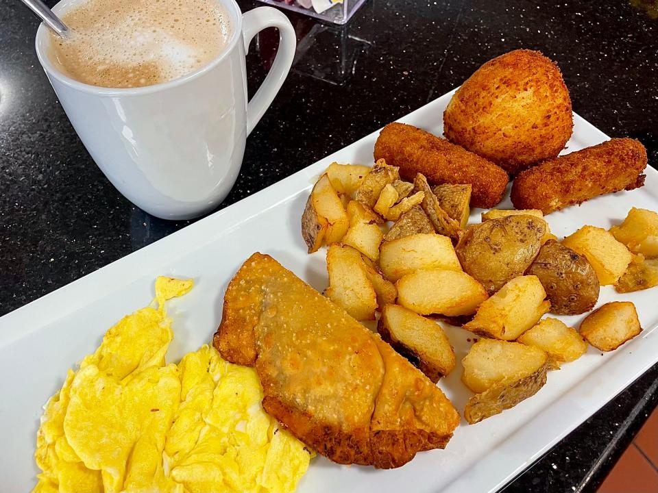 Cuban Sunrise, home fries and a chicken empanada from Domenech Corner in Bunnell.