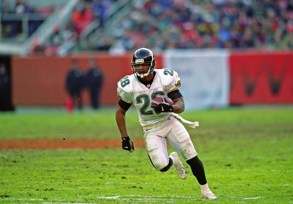 Running back Fred Taylor #28 of the Jacksonville Jaguars runs with the football during a game against the Cleveland Browns at Cleveland Browns Stadium on December 19, 1999 in Cleveland, Ohio. The Jaguars defeated the Browns 24-14.