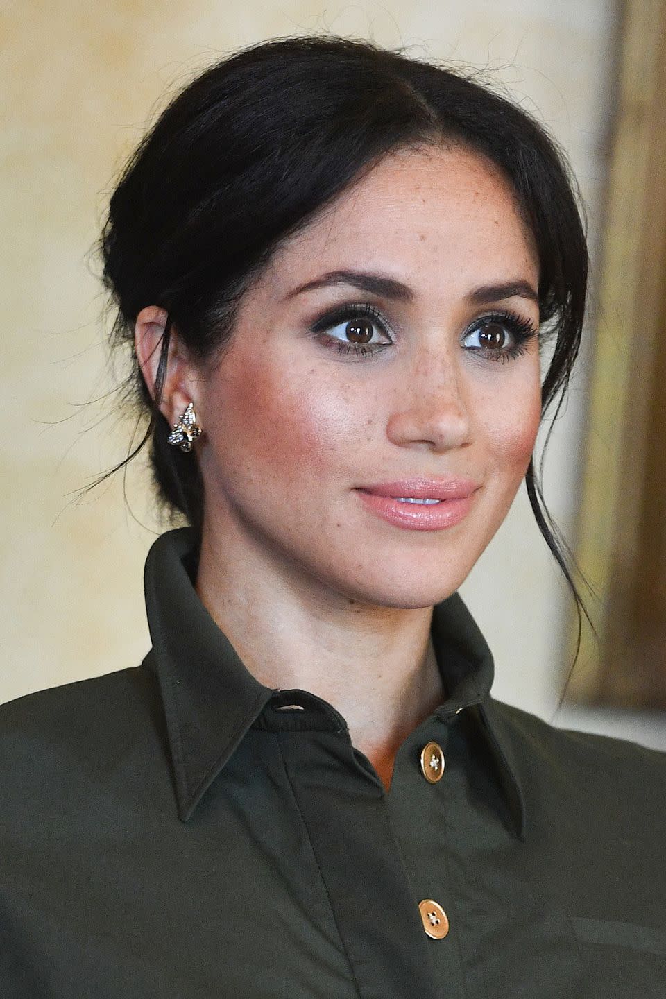 Meghan with rosy cheeks and smokey eyes in 2018