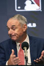 Major League Baseball commissioner Rob Manfred reacts to a question during a news conference in Arlington, Texas, Thursday, Dec. 2, 2021. Owners locked out players at 12:01 a.m. Thursday following the expiration of the sport's five-year collective bargaining agreement. (AP Photo/LM Otero)