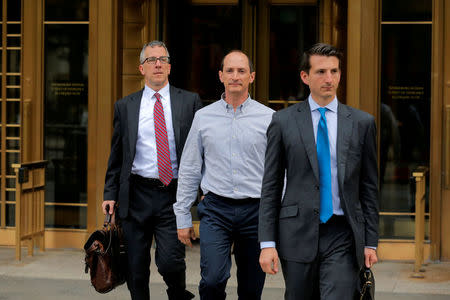 FILE PHOTO: Rob Olan (C), employee of the healthcare investment fund Deerfield Management, departs Federal Court in Manhattan after an arraignment for insider trading in New York, U.S., May 24, 2017. REUTERS/Lucas Jackson/File Photo