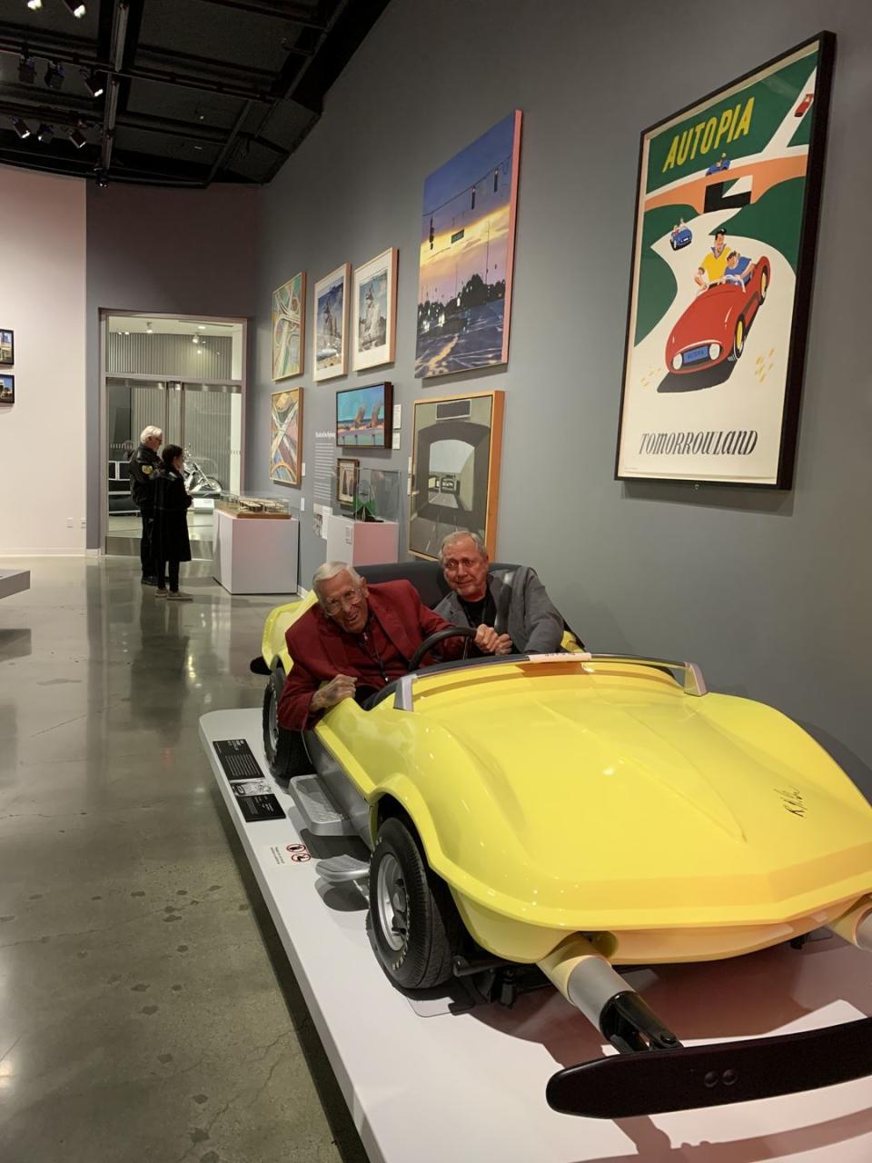 a person sitting in a yellow car