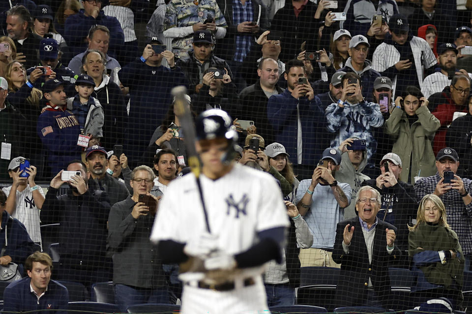 Fans watch as New York Yankees' Aaron Judge comes to bat during the third inning of the team's baseball game against the Baltimore Orioles on Friday, Sept. 30, 2022, in New York. (AP Photo/Adam Hunger)
