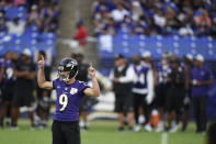 Baltimore Ravens kicker Justin Tucker reacts after booting a field goal during an NFL football training camp practice, Saturday, July 31, 2021, in Baltimore. (AP Photo/Gail Burton)