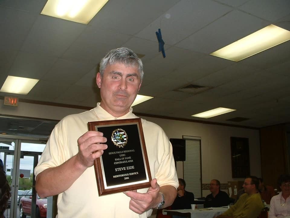 Steve Eide found his second home at Eastway Bowl more than 30 years ago when he started working part-time there through Lifescape. He worked there and bowled in several leagues throughout the week. If he wasn't working or bowling, Eide was watching others bowl and cheering them on. Here, Eide receives an award for his meritorious service in 2006.