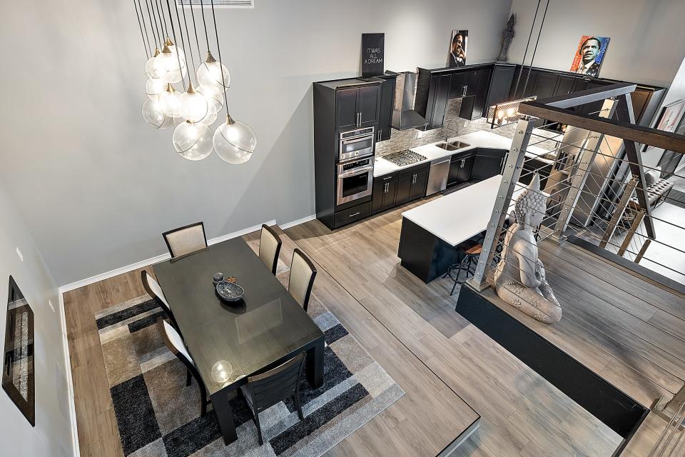 View of dining room and kitchen from lofted family room.