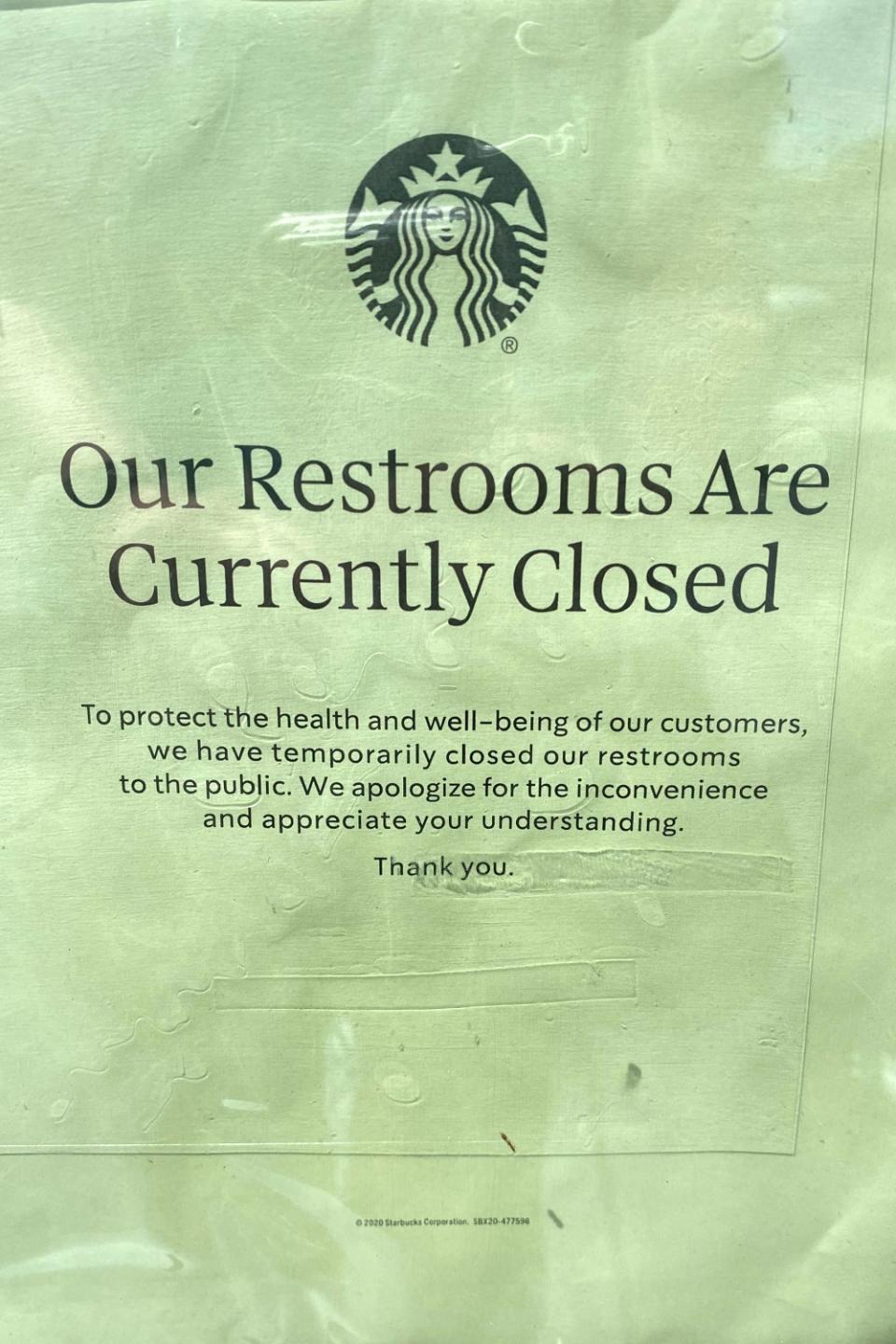 A sign saying restrooms are closed at a Starbucks on Melrose Avenue.