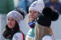 Alpine Skiing - FIS Alpine Skiing World Championships - Women's Downhill - St. Moritz, Switzerland - 12/2/17 - Gold medalist Ilka Stuhec of Slovenia is flanked by Austria's silver medalist Stephanie Venier (L) and bronze medalist Lindsey Vonn of the USA. REUTERS/Ruben Sprich