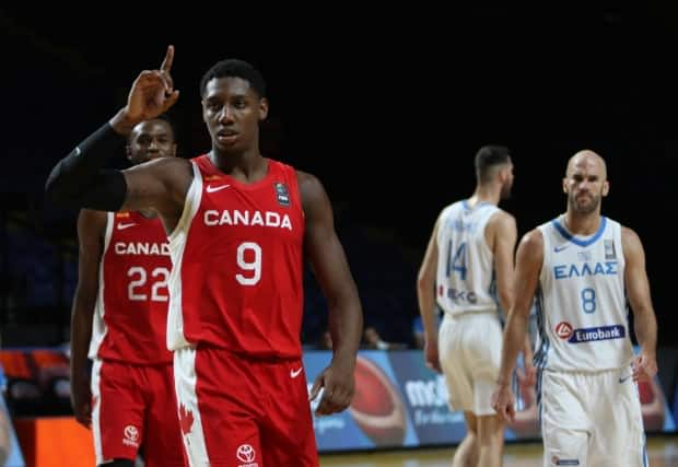 Canada's RJ Barrett celebrates after a 97-91 win over Greece in the FIBA Men's Olympic Qualifying tournament on Tuesday. (Chad Hipolito/The Canadian Press - image credit)