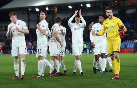 Britain Football Soccer - Crystal Palace v Swansea City - Premier League - Selhurst Park - 3/1/17 Swansea City's Lukasz Fabianski (R) and team mates celebrate after the game Reuters / Eddie Keogh Livepic